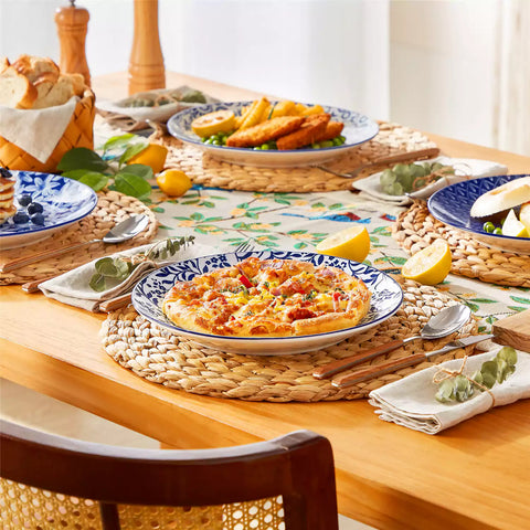Selene porcelain dinner plates set of 4 styled with pizza and bread on woven placemat mix and match Japanese inspired table setting