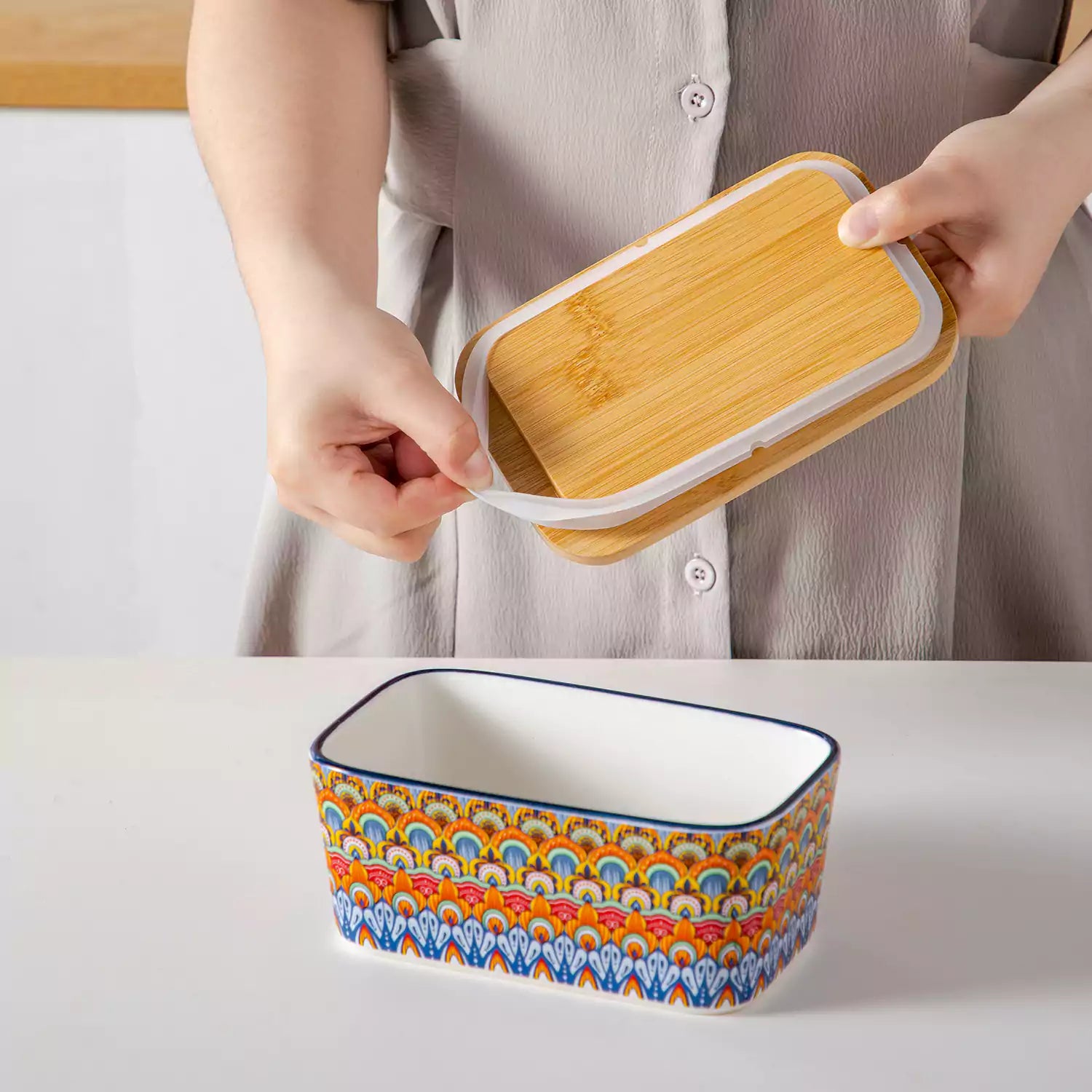 Hunter green porcelain butter dish with wooden lid in boho chic style - perfect for a colorful breakfast table with bread and coffee-vancasso