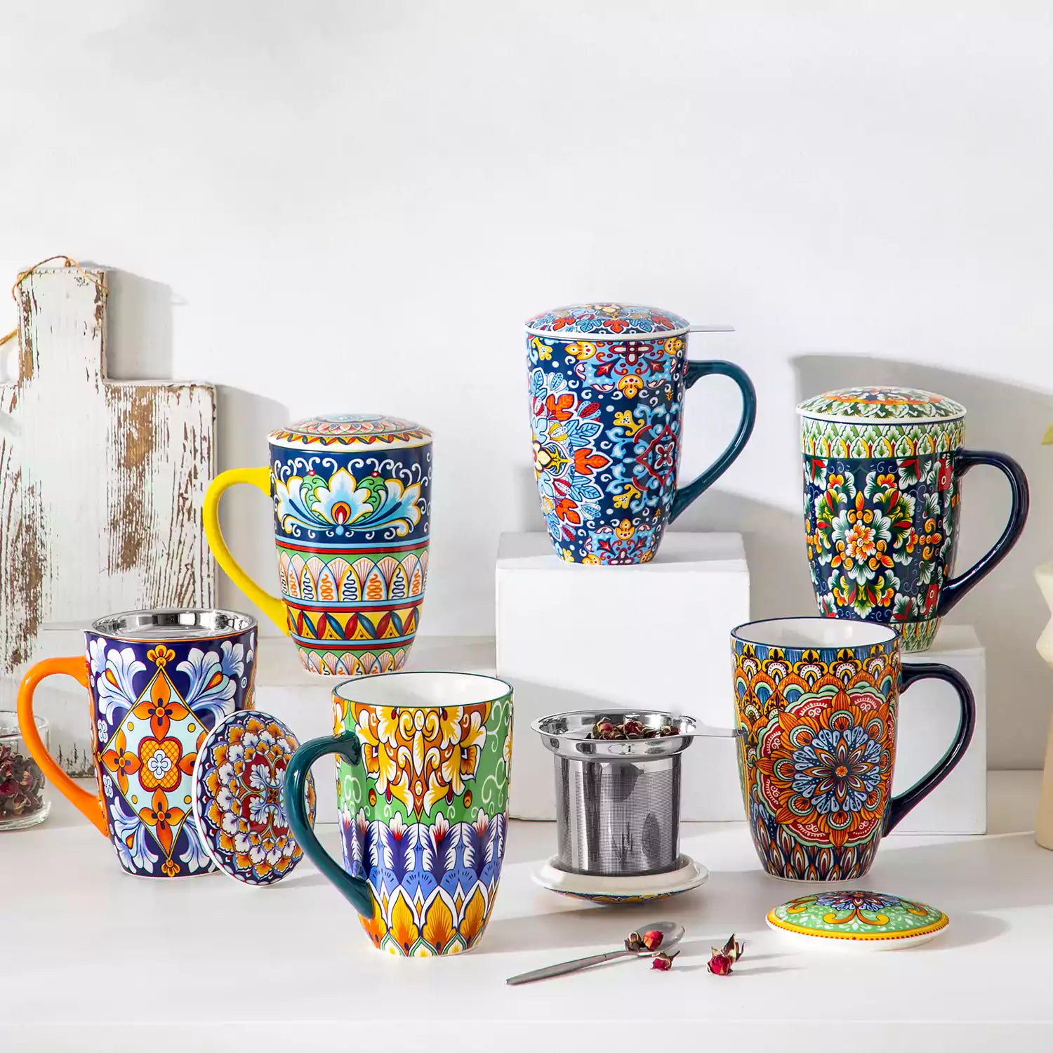 Simi tea mug with infuser and lid colorful golden yellow boho chic ceramic coffee cup with spoon and loose tea leaves on white background