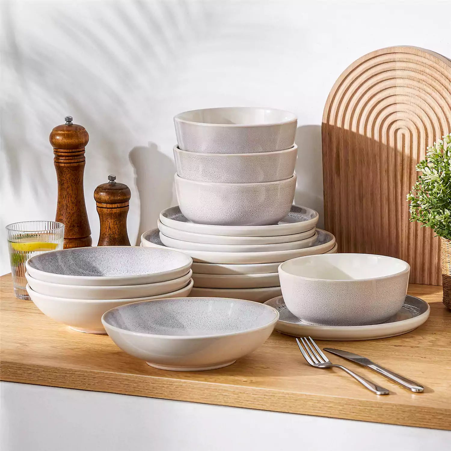 Snow 16-Piece Stoneware Set With Snowflake Glaze Perfect For Cozy Everyday Meals.