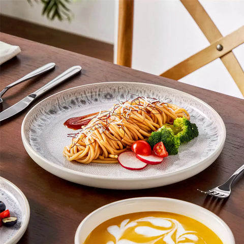 Snow 16-Piece Stoneware Set With Snowflake Glaze Perfect For Cozy Everyday Meals.