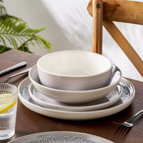 Snow 16-Piece Stoneware Set With Snowflake Glaze Perfect For Cozy Everyday Meals.