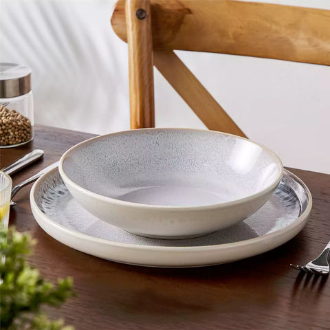 Snow 16-Piece Stoneware Set With Snowflake Glaze Perfect For Cozy Everyday Meals.