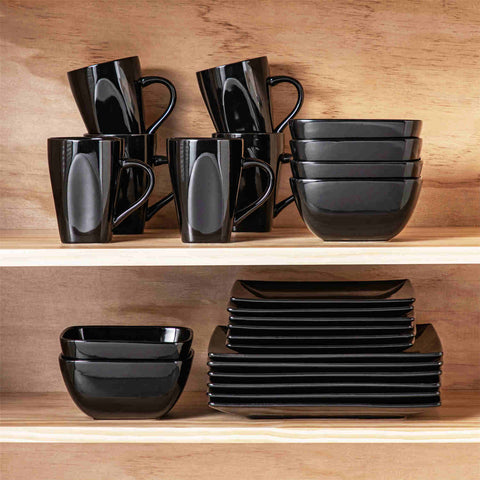 A glossy black 24-piece stoneware dinnerware set from the Soho collection - featuring a sleek square design with plates and mugs for 6 people-vancasso