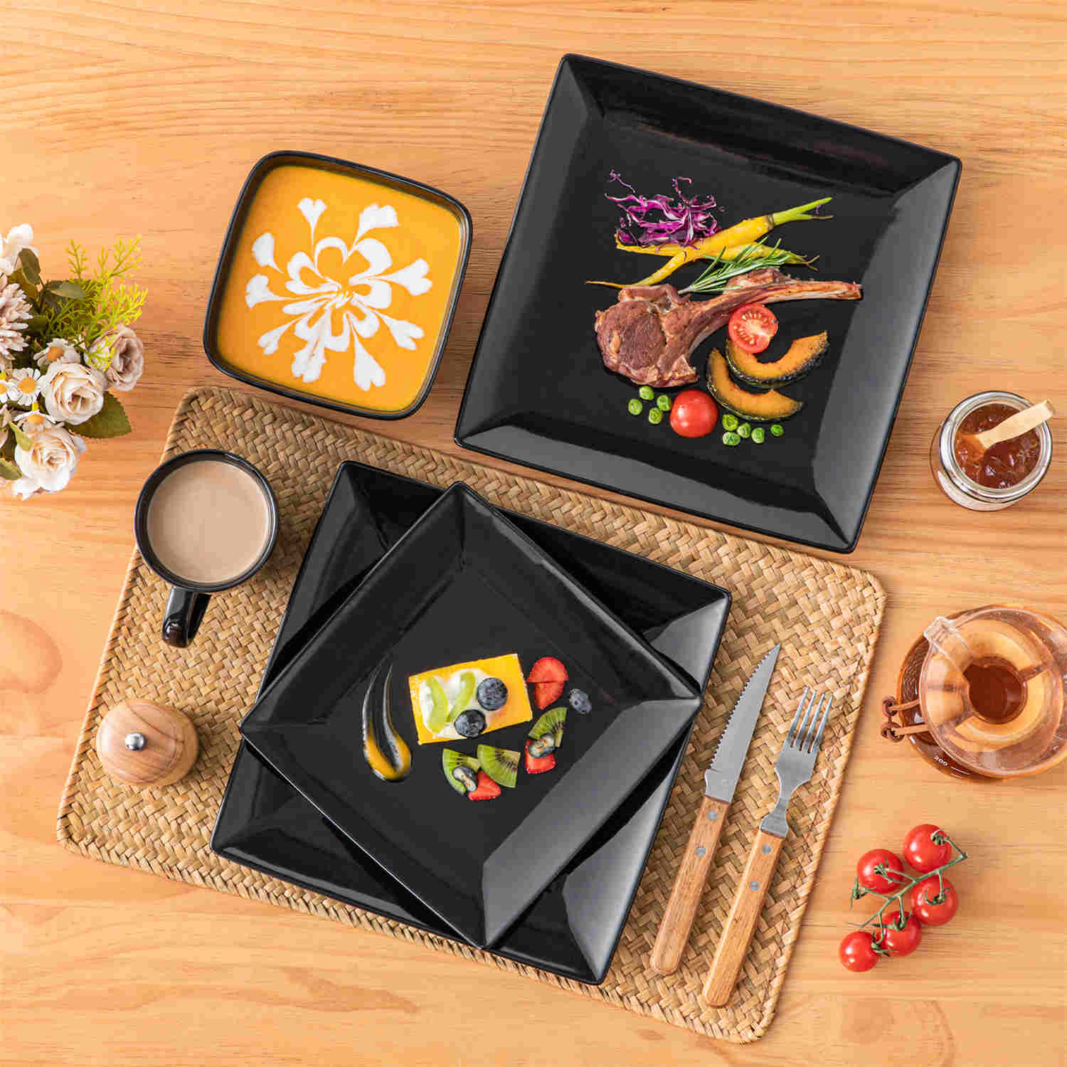 A glossy black 24-piece stoneware dinnerware set from the Soho collection - featuring a sleek square design with plates and mugs for 6 people-vancasso