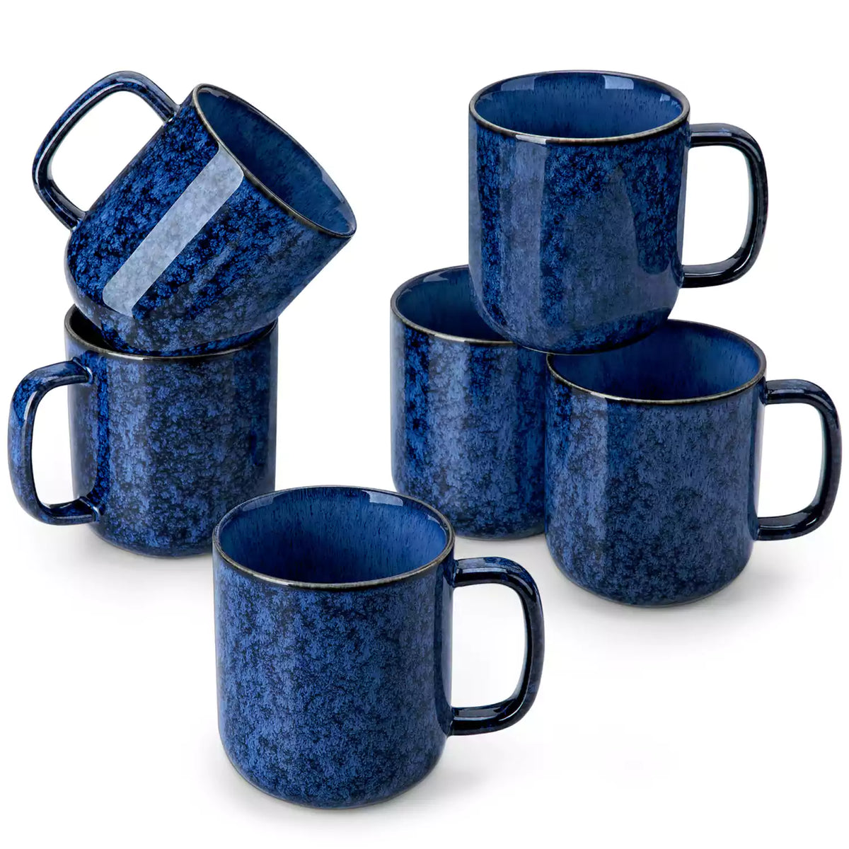 Starry gently curved blue mugs set of 6 displayed on a wooden table with a coffee maker and a plate of pastries