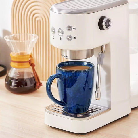 Set of 4 Starry 16oz stoneware mugs in blue with reactive glaze finish styled on a marble countertop with fresh coffee