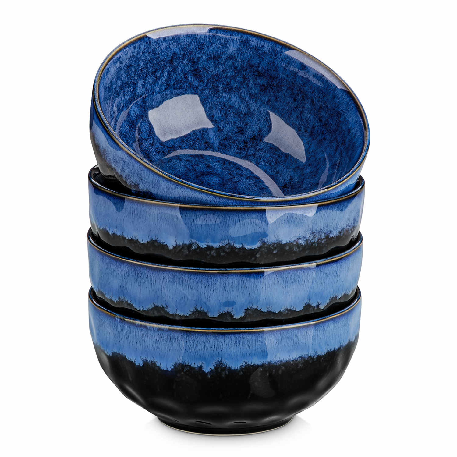 Starry reactive glaze cereal bowls in blue on a rustic wooden table - filled with creamy soup - pasta - and fresh fruit salad for a cozy - celestial dining vibe