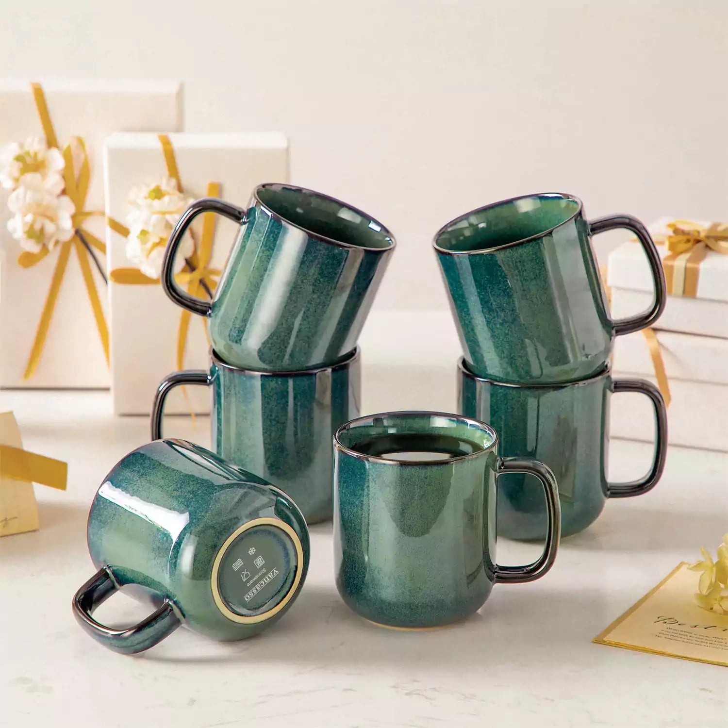 Starry gently curved green mugs set of 6 displayed on a wooden table with a coffee maker and a plate of pastries
