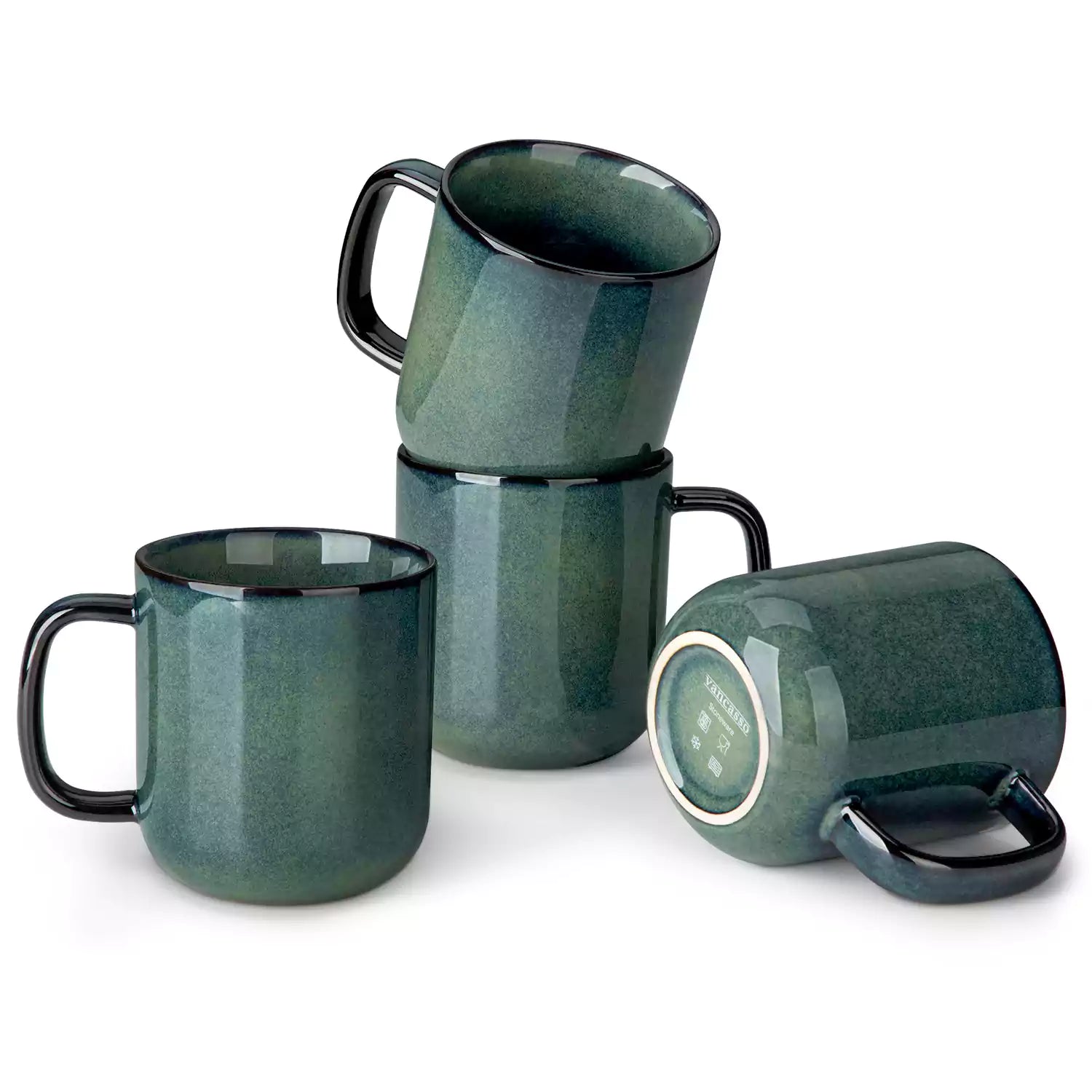 Four starry green 16oz stoneware mugs with latte art on wooden table beside coffee brewing equipment