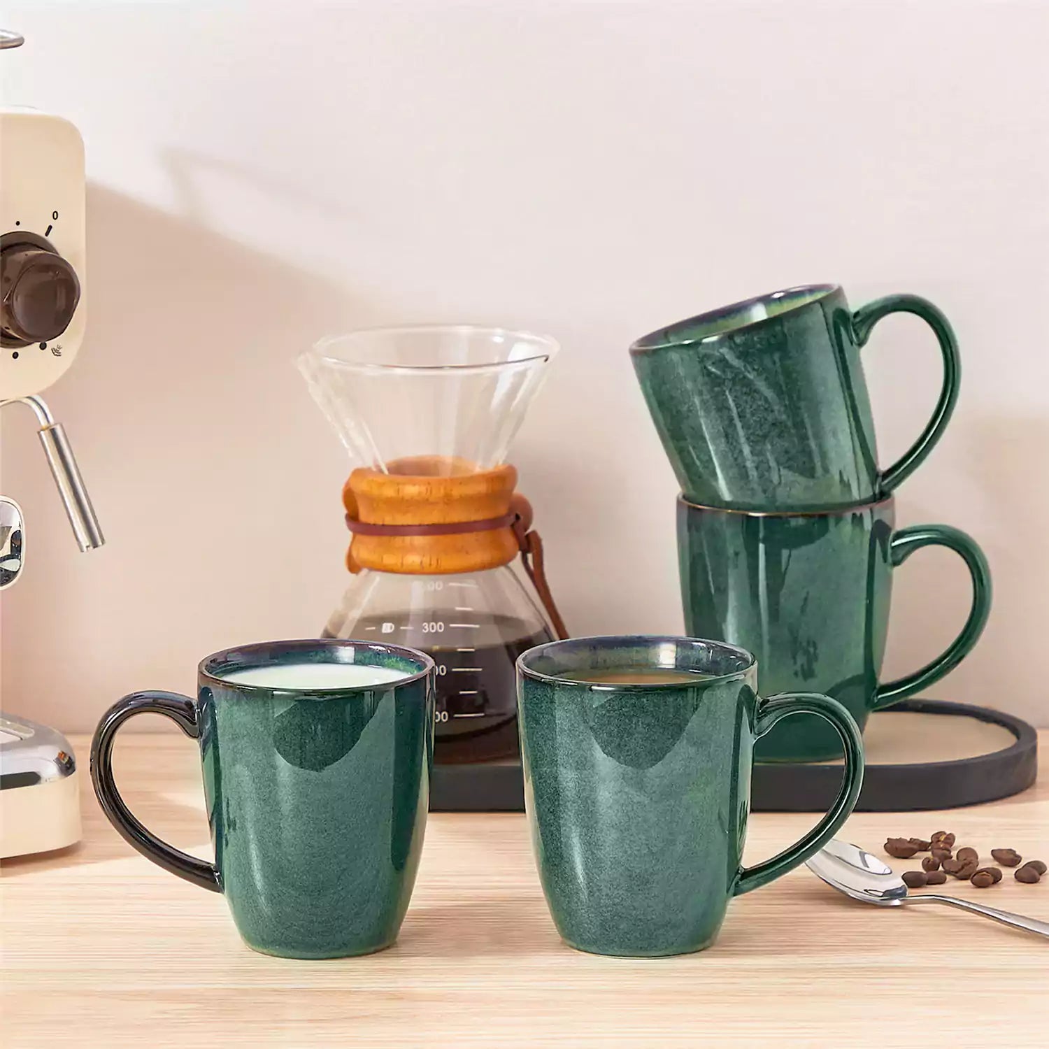 Green Starry 12oz stoneware mugs set of 4 with reactive glaze finish on a kitchen counter with coffee milk and fresh bread