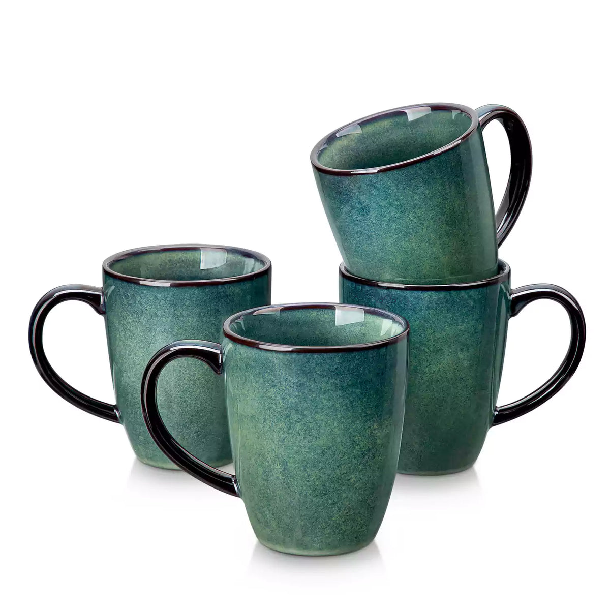 Green Starry 12oz stoneware mugs set of 4 with reactive glaze finish on a kitchen counter with coffee milk and fresh bread