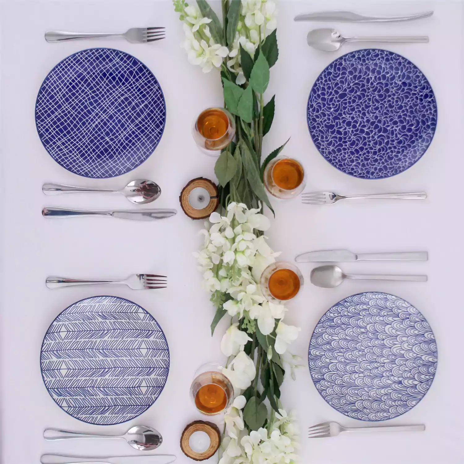Porcelain dinner plates set of 4 with classic Japanese indigo stripe patterns, featuring assorted designs, ideal for serving steak.