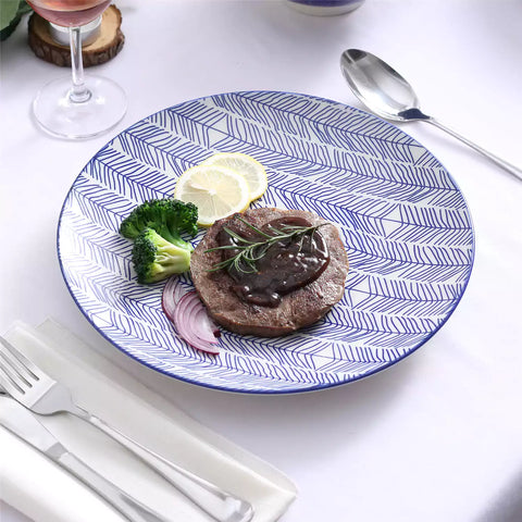 Porcelain dinner plates set of 4 with classic Japanese indigo stripe patterns, featuring assorted designs, ideal for serving steak.